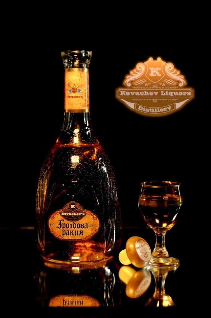 Bottled liquor with a label featuring Cyrillic script, a glass of clear spirit, and a distillery logo in a dark setting.